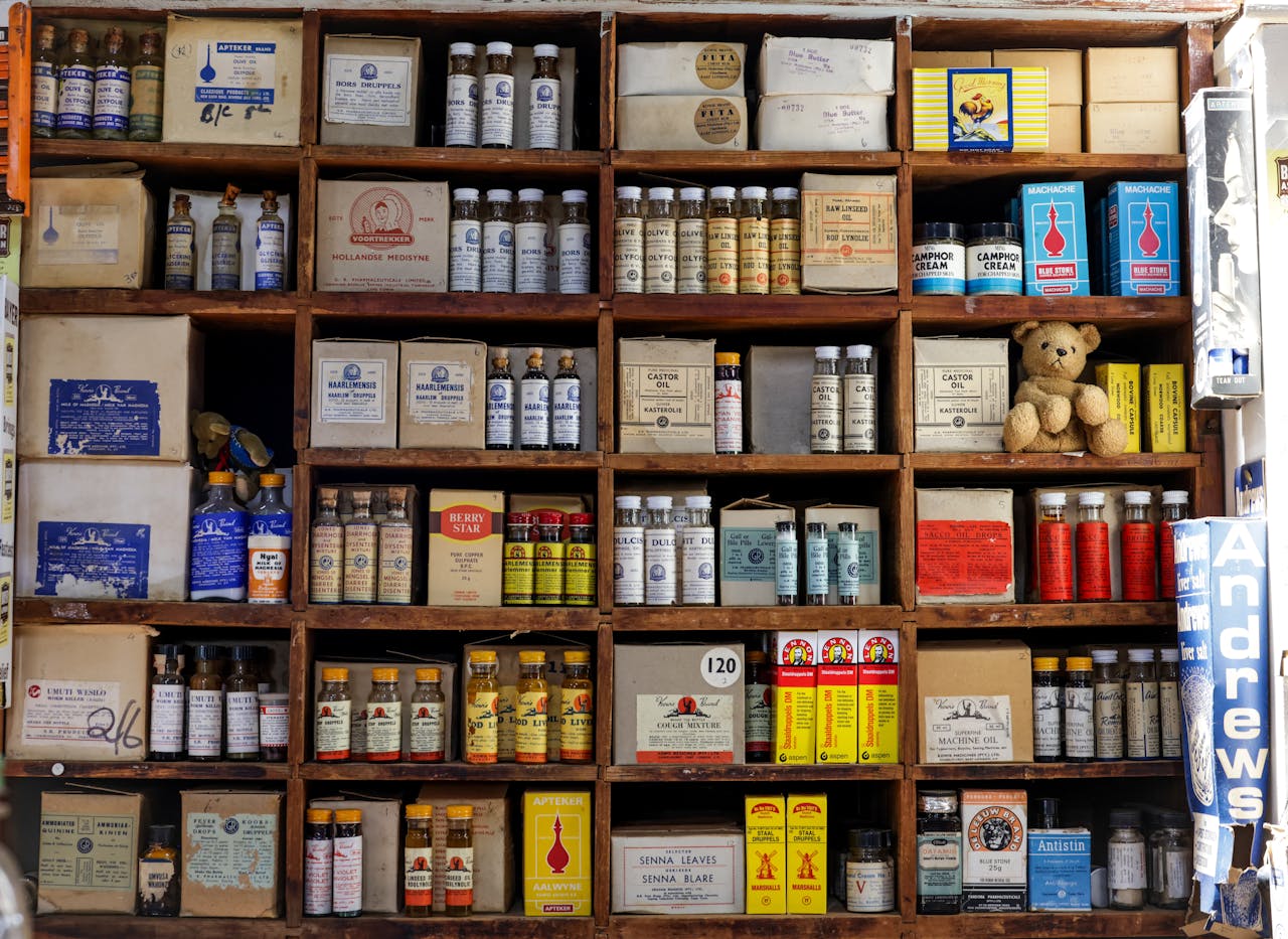 A vintage pharmacy shelf filled with old medicine bottles and boxes, showcasing a nostalgic aesthetic.